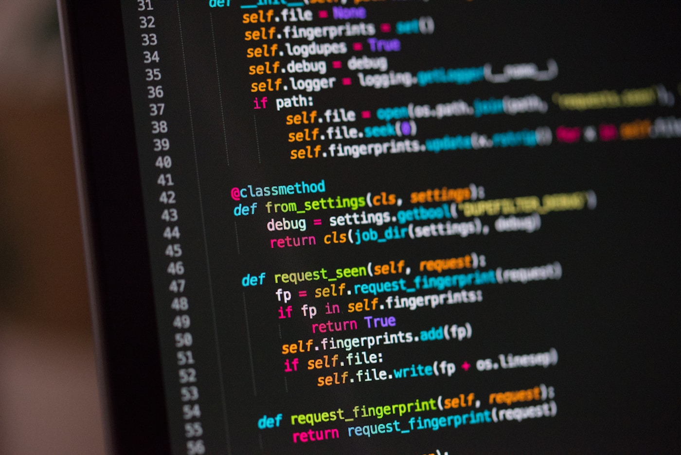 Code on a laptop in a focused development workspace